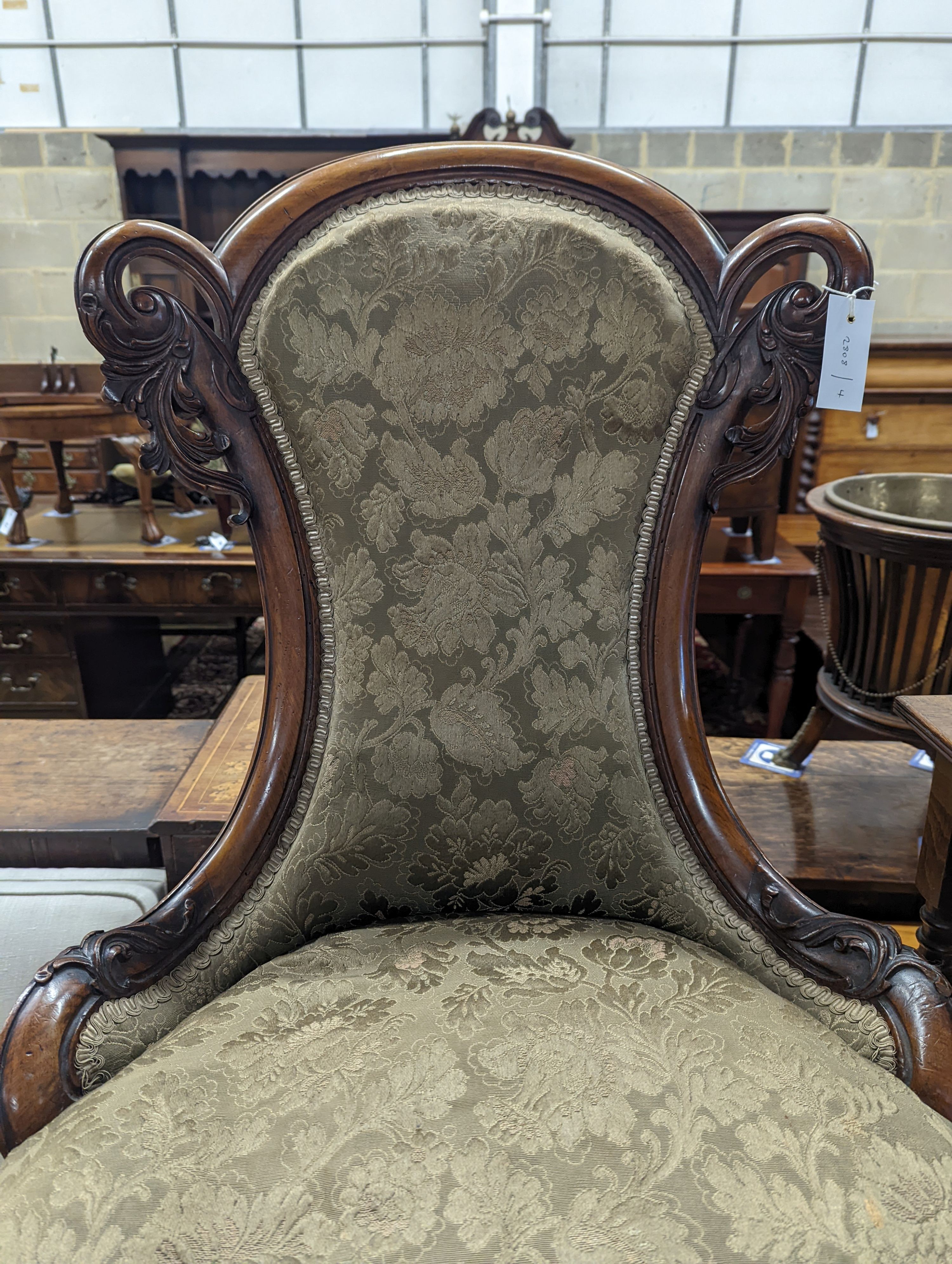A Victorian walnut nursing chair together with a reproduction nest of tea tables